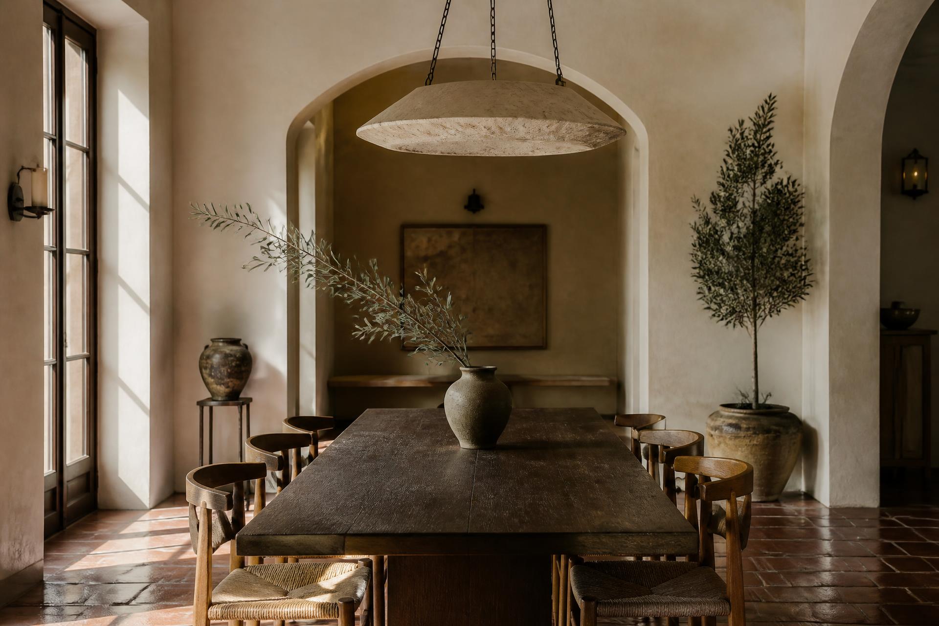 Mediterranean dining room with rustic walnut table